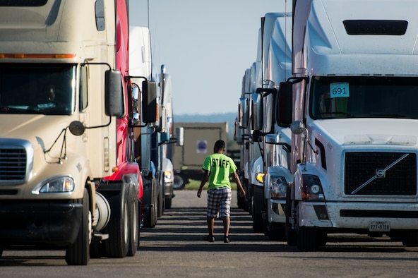 A semi truck driver returns to his truck to receive humanitarian supplies at Seguin Auxiliary Airfield in support of the Hurricane Harvey relief efforts, Sept. 1, 2017. Hurricane Harvey formed in the Gulf of Mexico and made landfall in southeastern Texas, bringing record flooding and destruction to the region. U.S. military assets supported FEMA as well as state and local authorities in rescue and relief efforts.
(U.S. Air Force photo by Tech. Sgt. Larry E. Reid Jr., Released)