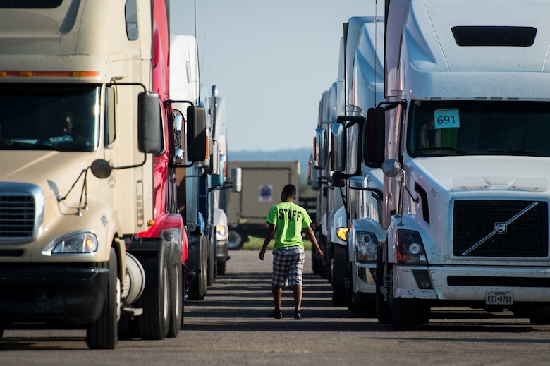 A semi truck driver returns to his truck to receive humanitarian supplies at Seguin Auxiliary Airfield in support of the Hurricane Harvey relief efforts, Sept. 1, 2017. Hurricane Harvey formed in the Gulf of Mexico and made landfall in southeastern Texas, bringing record flooding and destruction to the region. U.S. military assets supported FEMA as well as state and local authorities in rescue and relief efforts.
(U.S. Air Force photo by Tech. Sgt. Larry E. Reid Jr., Released)