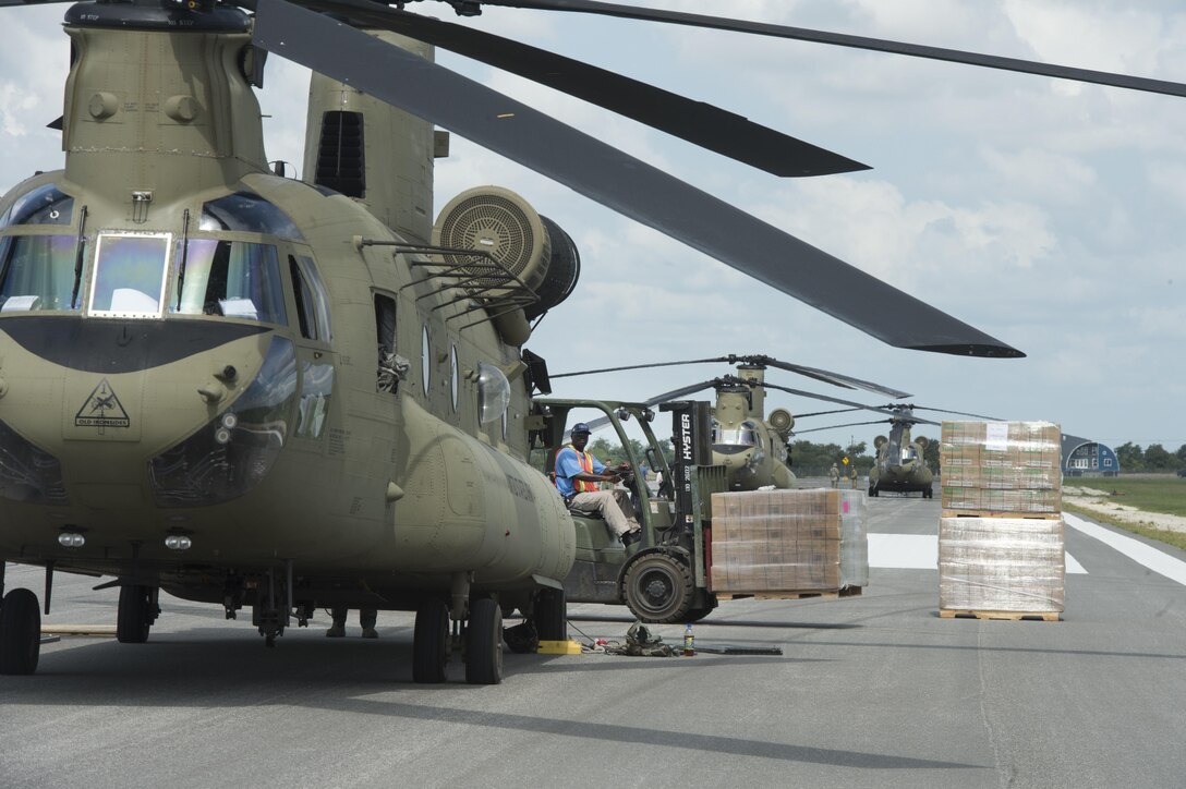 A Defense Logistics Agency forklift operator prepares to pallet of MREs at JBSA Randolph Auxiliary Airfield, Seguin, Texas, Sept. 5, 2017. Three Chinooks loaded 20 pallets of MREs to to transport as part of the relief efforts for Hurricane Harvey. The category-4 hurricane, with wind speeds up to 130 miles per hour, made landfall Aug. 25, 2017. Days after the hurricane reached Texas, more than 50 inches of rain flooded the coastal region. (U.S. Air Force Photo by Tech. Sgt. Chad Chisholm/Released)