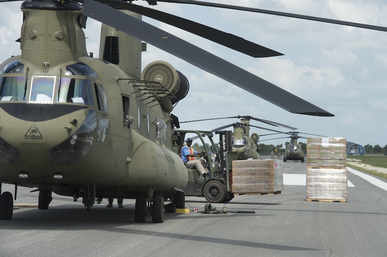 A Defense Logistics Agency forklift operator prepares to pallet of MREs at JBSA Randolph Auxiliary Airfield, Seguin, Texas, Sept. 5, 2017. Three Chinooks loaded 20 pallets of MREs to to transport as part of the relief efforts for Hurricane Harvey. The category-4 hurricane, with wind speeds up to 130 miles per hour, made landfall Aug. 25, 2017. Days after the hurricane reached Texas, more than 50 inches of rain flooded the coastal region. (U.S. Air Force Photo by Tech. Sgt. Chad Chisholm/Released)