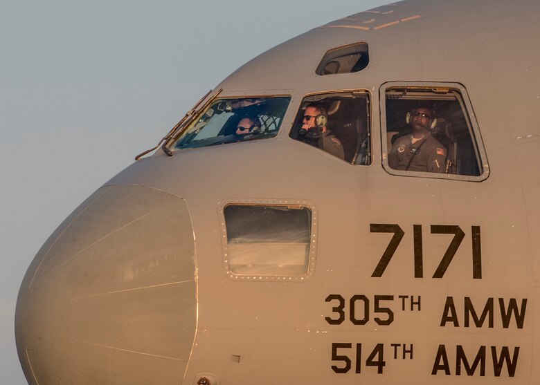 Pilots of a C-17 Globemaster III from Joint Base McGuire-Dix-Lakehurst arrive to Scott Air Force Base to pick up 375th Aeromedical Evacuation Squadron personnel and humanitarian aid cargo in support of the Hurricane Harvey relief and response efforts, Scott Air Force Base, Ill., Aug. 30, 2017.
