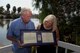 Bruce Hallberg and Anne Hallberg, the siblings of Sgt. 1st Class Roger Hallberg, a green beret who went missing during the Vietnam War in March 1967, hold the Silver Star Sergeant Hallberg was awarded in December 2006 for gallantry in action, outside their home in Discovery Bay, Calif., Sept. 5, 2017. Sergeant Hallberg has been missing for more than 50 years. (U.S. Air Force photo by Tech. Sgt. James Hodgman)