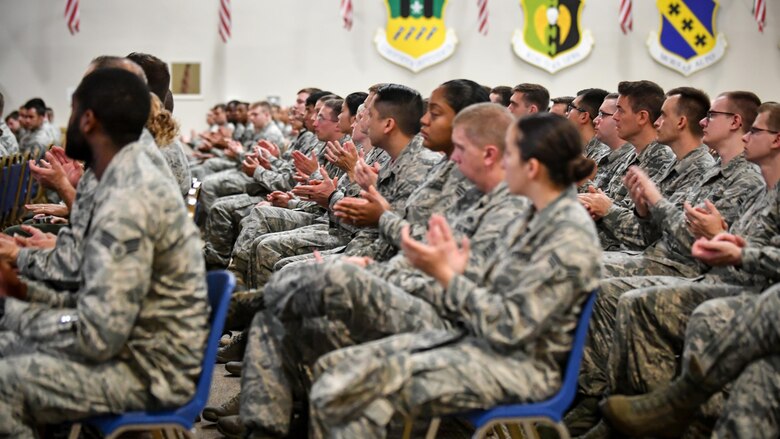 Airmen applaud during a safety day briefing at Barksdale Air Force Base, La., Aug. 31, 2017. With summer coming to an end and fall bringing in the start of the hunting season, Wing Leadership and guest speaker Tony Crow spoke to team Barksdale about risk management and applying safety both on and off-duty.