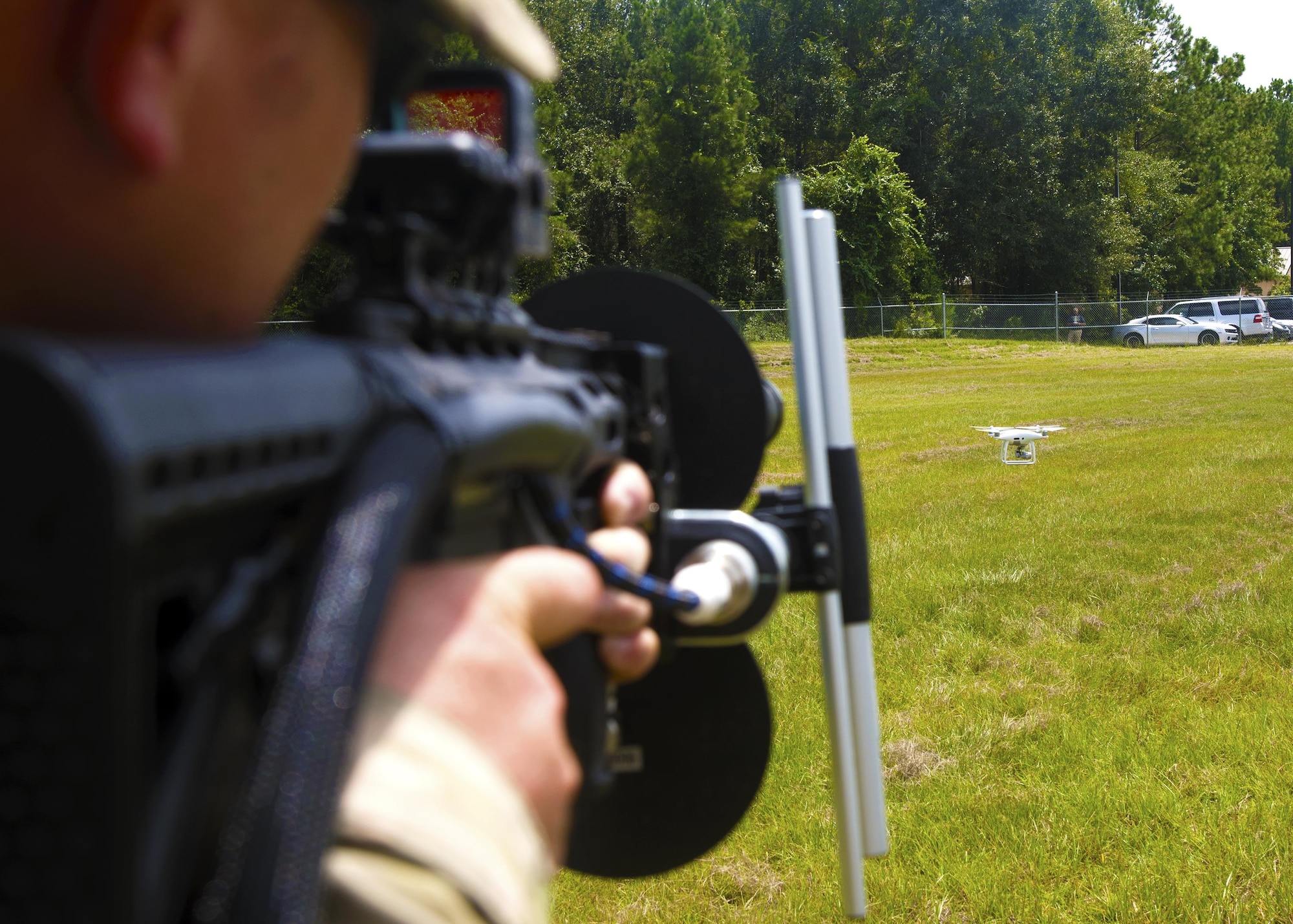 Tech. Sgt. Jarret Barnes, 823d Base Defense Squadron Radio Frequency Transmissions system specialist, aims down at a drone, Aug. 30, 2017, at Moody Air Force Base, Ga. Airmen from the 823d BDS we’re taught the basics of drone detection, identification and neutralization to ensure readiness while deployed  (U.S. Air Force photo by Airman Eugene Oliver)