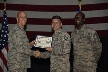 Airmen receive certificates for their selection to staff sergeant Aug. 24, 2017, at McConnell Air Force Base, Kan. The Air Force selected 14,181 senior airmen for promotion, 186 of which are assigned to McConnell. (U.S. Air Force photo/Airman 1st Class Erin McClellan)