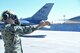 A sailor marshals an F-16 Fighting Falcon from Homestead Air Reserve Base, Florida, Sept. 6, 2017, at Naval Air Station Fort Worth Joint Reserve Base, Texas. Fourteen aircraft relocated here today due to Hurricane Irma’s anticipated landfall. The base serves as a safe haven for military aircraft that are in the path of the hurricane. (U.S. Air Force photo by Maj. Candice Allen)