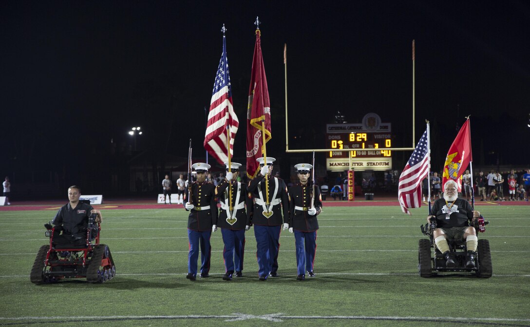 U.S. Marines with Recruiting Station San Diego, Color Guard present the colors during the opening ceremony of the Honor Bowl Championship Game at Cathedral Catholic High School, San Diego, Sept. 2, 2017. The Honor Bowl is an elite football tournament which highlights some of the most talented high school teams across the country, and honors service members both killed and wounded in action. (U.S. Marine Corps Photo by Sgt. Taylor Morton/Released)
