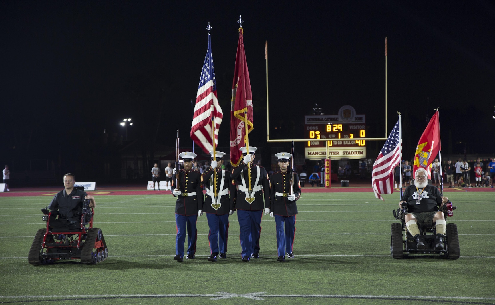 U.S. Marines with Recruiting Station San Diego, Color Guard present the colors during the opening ceremony of the Honor Bowl Championship Game at Cathedral Catholic High School, San Diego, Sept. 2, 2017. The Honor Bowl is an elite football tournament which highlights some of the most talented high school teams across the country, and honors service members both killed and wounded in action. (U.S. Marine Corps Photo by Sgt. Taylor Morton/Released)