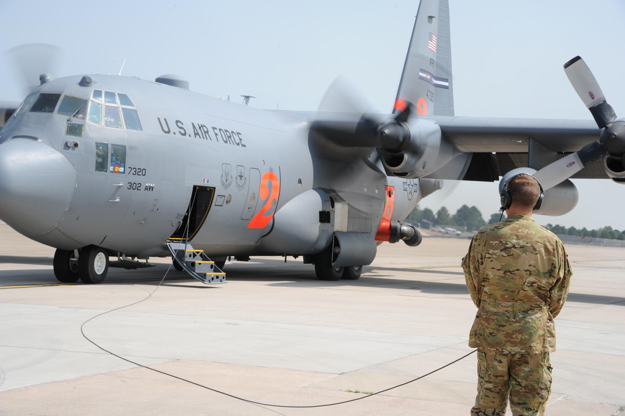 A Modular Airborne Fire Fighting System equipped C-130 Hercules aircraft from the Air Force Reserve's 302nd Airlift Wing prepares to depart Peterson Air Force Base, Colorado, Sept. 6, 2017.