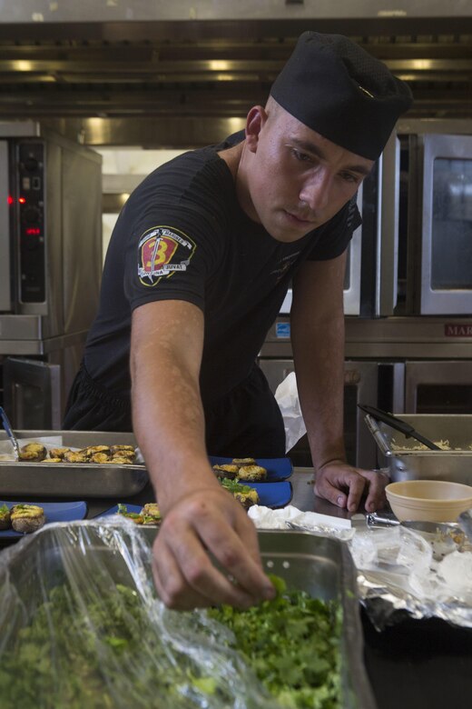 U.S. Marine Corps Lance Cpl. Bryan Carter, a food service specialist with 2nd Battalion, 3rd Marine Regiment, prepares his appetizer during the Chef of the Quarter cook-off competition at Anderson Hall aboard Marine Corps Base Hawaii, August 23, 2017. After a series of evaluations to include a 50-question written test, an oral board and a uniform inspection, the U.S. Marines with top three highest combined scores were selected to be a part of the cook-off. The competitors used chicken, curry, cream cheese and kiwi fruit as items for their appetizer, entrée and desserts. (U.S. Marine Corps photo by Cpl. Zachary Orr)