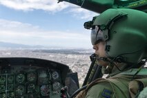 Capt. Jonathan Bonilla, 459th Airlift Squadron UH-1N operations flight commander, flies near Odawara City