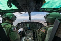 1st Lt. Emerson Woerner and Capt. Jonathan Bonilla, both 459th Airlift Squadron UH-1N pilots, fly over Sagami Bay