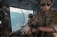 Staff Sgt. Justin Bender, 374th Operations Support Squadron survival, evasion, resistance and escape specialist, wears gloves over Sagami Bay, Japan, Sept. 1, 2017, during the 2017 Big Rescue Kanagawa Disaster Prevention Drill. Airmen of the 459 AS demonstrated their rescue capabilities among local participants during the Big Rescue Kanagawa for the first time. (U.S. Air Force photo by Yasuo Osakabe)