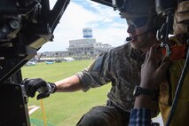 Staff Sgt. Justin Bender, 374th Operations Support Squadron survival, evasion, resistance and escape specialist, completes a hoist demonstration in front of local participants’ during the 2017 Big Rescue Kanagawa Disaster Prevention Drill at Odawara City