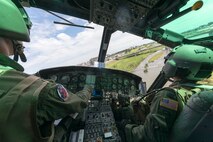 1st Lt. Emerson Woerner and Capt. Jonathan Bonilla, both 459th Airlift Squadron UH-1N pilots, fly over the Odawara