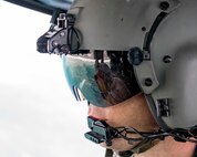 Tech. Sgt. Nicholas Poe, 459th Airlift Squadron special missions aviator, communicates with crew members