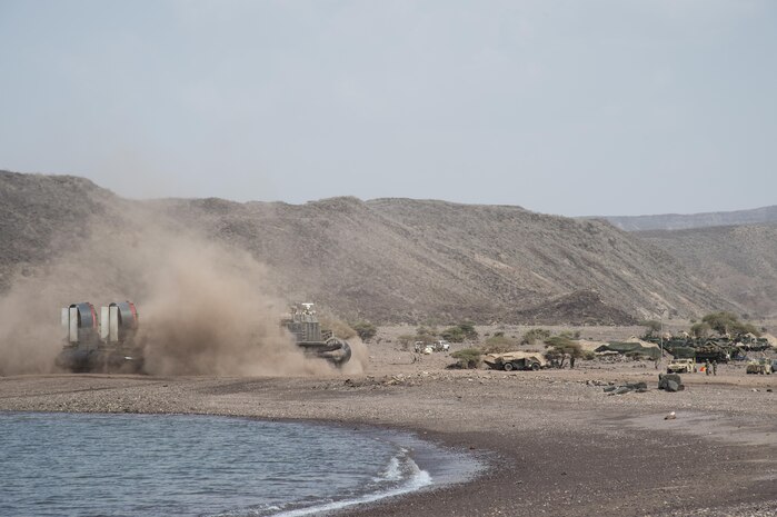 Waves of U.S. Marines from the 15th Marine Expeditionary Unit launch from Landing Craft Air Cushion off USS Pearl Harbor (LSD 52) and USS San Diego (LPD 22) in a calculated formation, to strategically position themselves in preparation for a beach landing during Alligator Dagger – a two-week exercise that prepares incoming Naval Amphibious Forces, Task Force 51/5th Marine Expeditionary Unit's Amphibious Readiness Group/Marine Expeditionary Unit teams to integrate and synchronize  warfighting capabilities in the U.S. Central Command's area of operations.