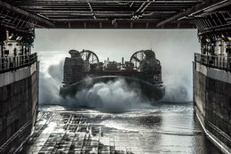A landing craft, air cushion assigned to Assualt Craft Unit (ACU) 5 embarked aboard the amphibious transport dock ship USS San Diego (LPD 22), prepares to enter the ship's well deck during exercise Alligator Dagger.