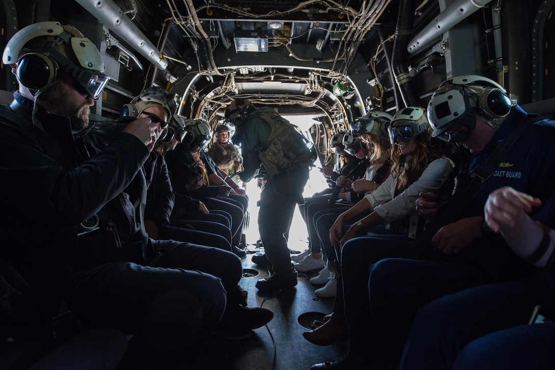 Local dignitaries from Detroit, enjoy their military experience during the MV-22 Osprey flights over Detroit as part of Marine Week, Sept. 6, 2017.