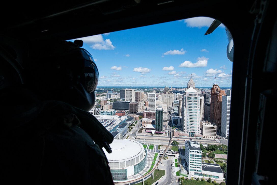 A Marine with Marine Medium Tiltrotor Squadron 166 enjoys the view of Detroit on an MV-22 Osprey flight during Marine Week Detroit, Sept. 6, 2017. Marine Week Detroit is a chance to reconnect with our Marines, sailors, veterans and their families from different generations.