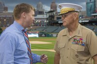 Commandant of the Marine Corps Gen. Robert B. Neller, right, speaks with a fan attending a baseball game at Comerica Park, Detroit, Mich., Sept. 6, 2017. Neller attended the opening of Marine Week Detroit, and then threw the ceremonial first pitch of the Tigers game against the Kansas City Royals. (U.S. Marine Corps photo by Cpl. Samantha K. Braun)