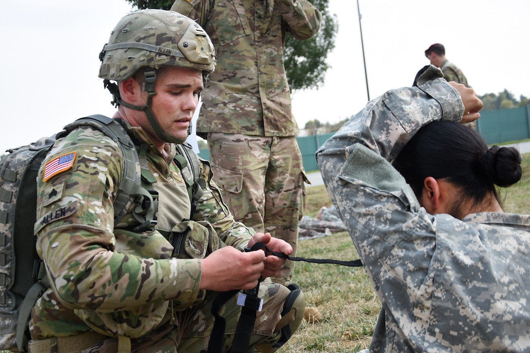 A soldier provides medical aid to a mock casualty during the Beat Medic Competition