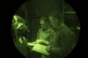 Senior Airmen Tom Saunders, left, and Jacob Snider, 774th Expeditionary Airlift Squadron loadmasters, review a checklist while preparing for an airdrop at Kandahar Airfield, Afghanistan, Aug. 24, 2017. An airdrop is one of many methods airlift Airmen use to deliver cargo. When planning on how to deliver cargo, the type of environment is a key factor in the decision. Weather, the danger present in the area and terrain are just a few of the factors used in deciding what method to use. (U.S. Air Force photo by Staff Sgt. Benjamin Gonsier)