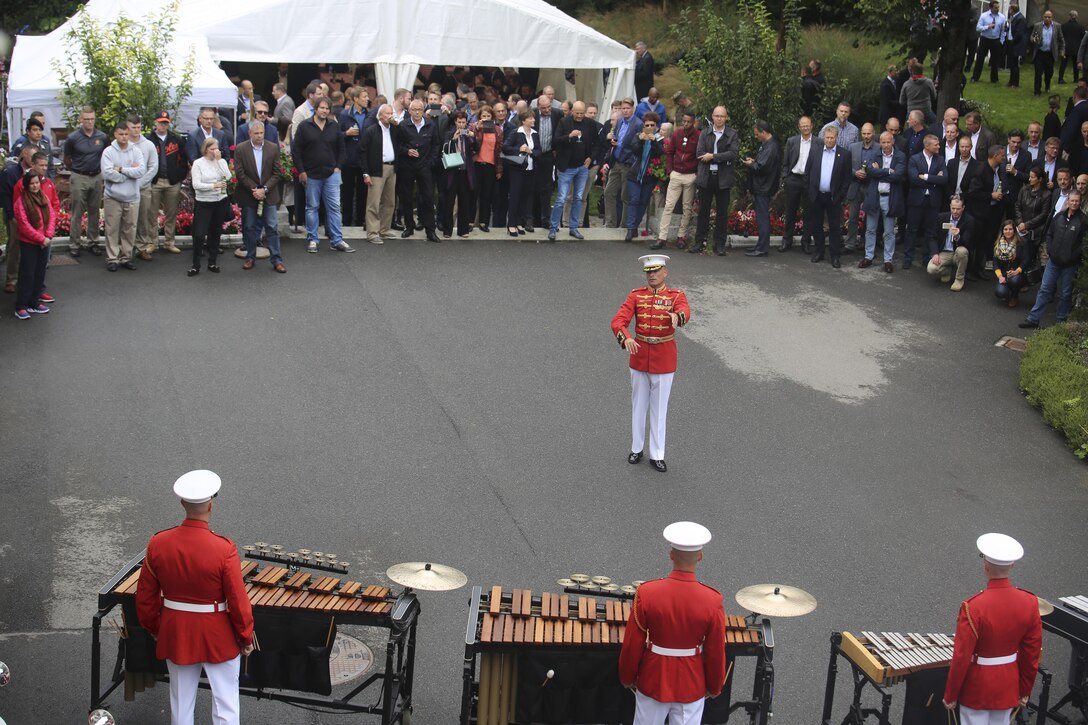 Major Christopher Hall, commanding officer, “The Commandant’s Own” U.S. Marine Drum & Bugle Corps, conducts the D&B as they perform musical ballads for a Law Enforcement Reception at the U.S. Embassy Residence in Bern, Switzerland, Sept. 1, 2017. The D&B performed a concert for high-ranking officials and their friends and families. (Official Marine Corps photo by Lance Cpl. Damon Mclean/Released)