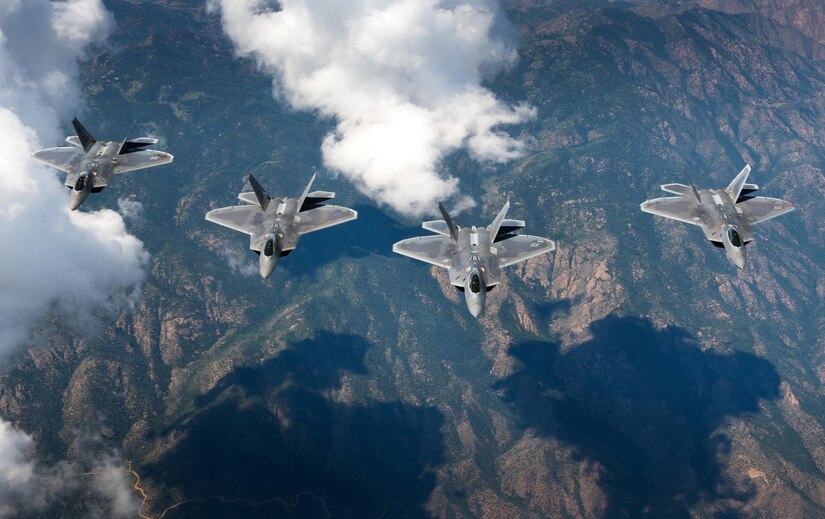 A four-ship formation of U.S. Air Force F-22 Raptors f from the 94th Fighter Squadron and 1st Fighter Wing  fly in formation over the Rocky Mountain Range in Colo., while in transit back to Joint Base Langley-Eustis, Va. after participating in Red Flag 17-4 Aug. 26, 2017. (U.S. Air Force photo by Staff Sgt. Carlin Leslie)