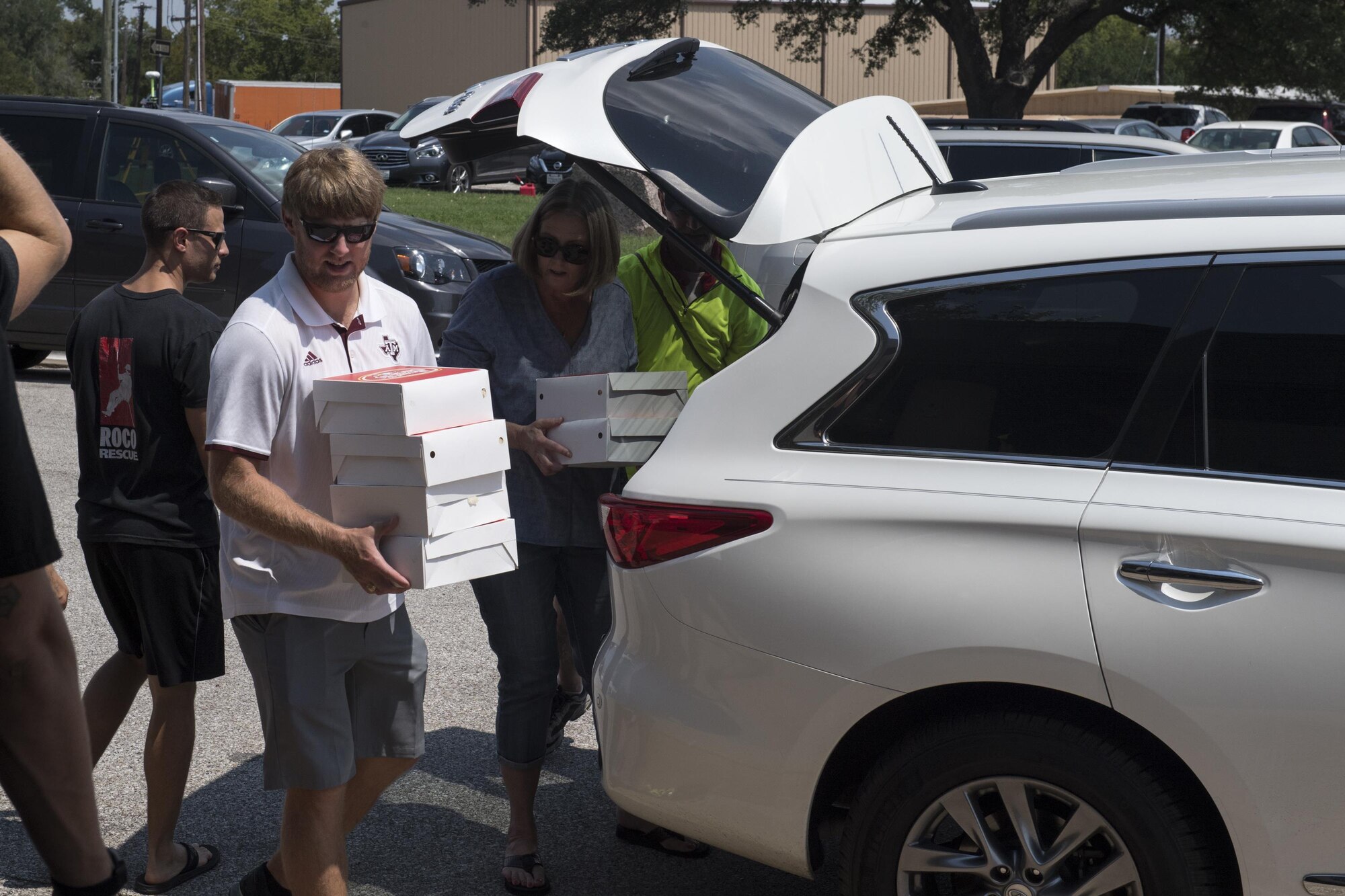 Volunteers from the local community unload food, Sept. 2, 2017, at Easterwood Airport in College Station, Texas.