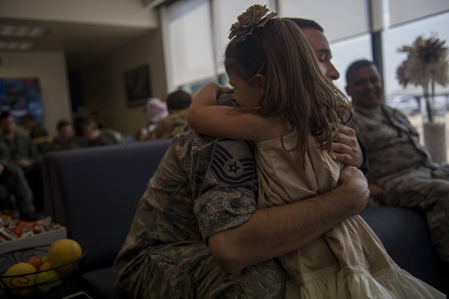 Kaitlyn O'Rear, 3, gives free hugs to service members, Sept. 2, 2017, at Easterwood Airport in College Station, Texas.