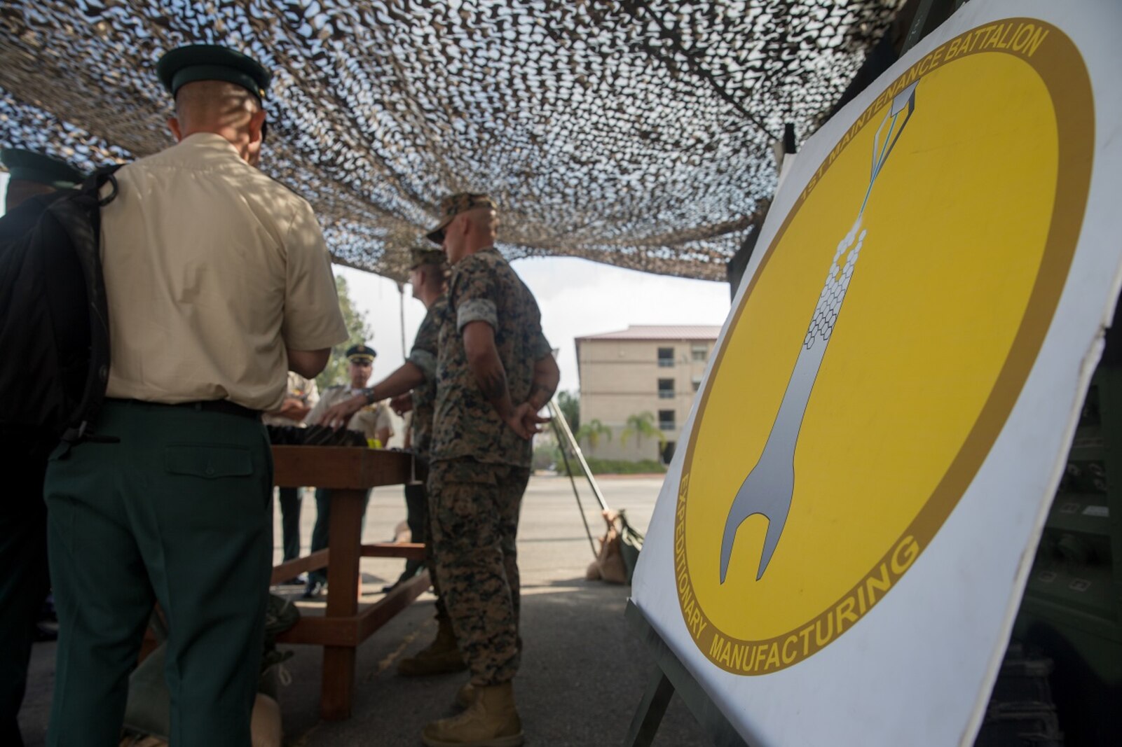 Students of the Columbian War College’s General Staff Course observe a 1st Marine Logistics Group static display at Camp Pendleton, Calif., Sept. 6, 2017. The students observed parts of the U.S. military strategic war-time contingencies to apply this knowledge to their units. (U.S. Marine Corps photo by Lance Cpl. Roderick Jacquote)