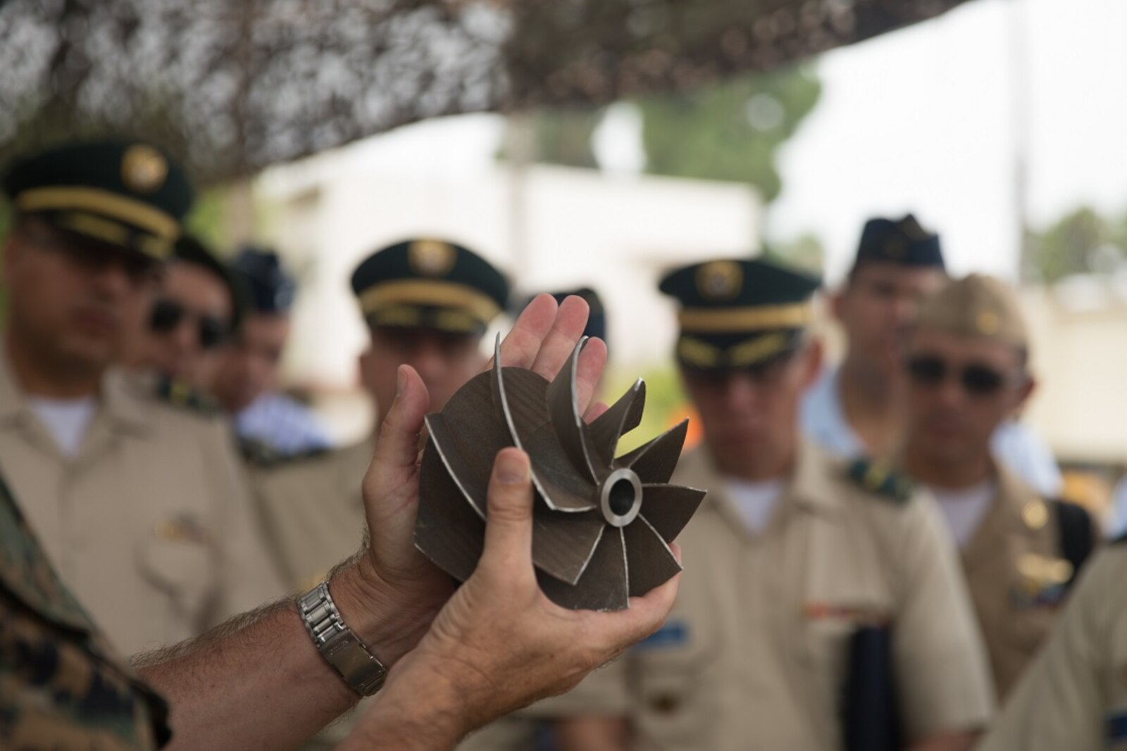U.S. Marine Corps Col. Jaime Collazo, the commanding officer of Combat Logistics Regiment 15, 1st Marine Logistics Group, presents a scavenge fan blade to the students from the Columbian War College’s General Staff Course at Camp Pendleton, Calif., Sept. 6, 2017. The Columbian War College established the General Staff Course as a requirement for promotion to the rank of lieutenant colonel for service members in the Colombian Army, Navy and Air Force. (U.S. Marine Corps photo by Lance Cpl. Roderick Jacquote)