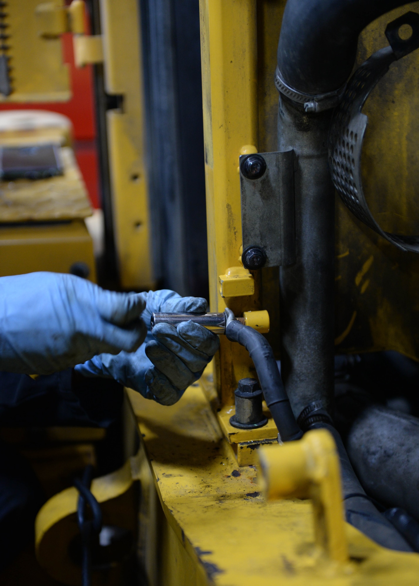 Airman 1st Class James Walton, vehicular equipment maintainer at the 673d Logistics Readiness Squadron Heavy Equipment Shop, tightens a bolt on an Oshkosh H-series truck engine installation Aug. 29, 2017, at Joint Base Elmendorf-Richardson, Alaska. There are 37 Airmen and 11 civilians, which specialize in vehicular equipment maintenance at the 673d LRS D29 shop, ensuring that the 83 heavy duty snow-removal trucks remain in working order at all times.