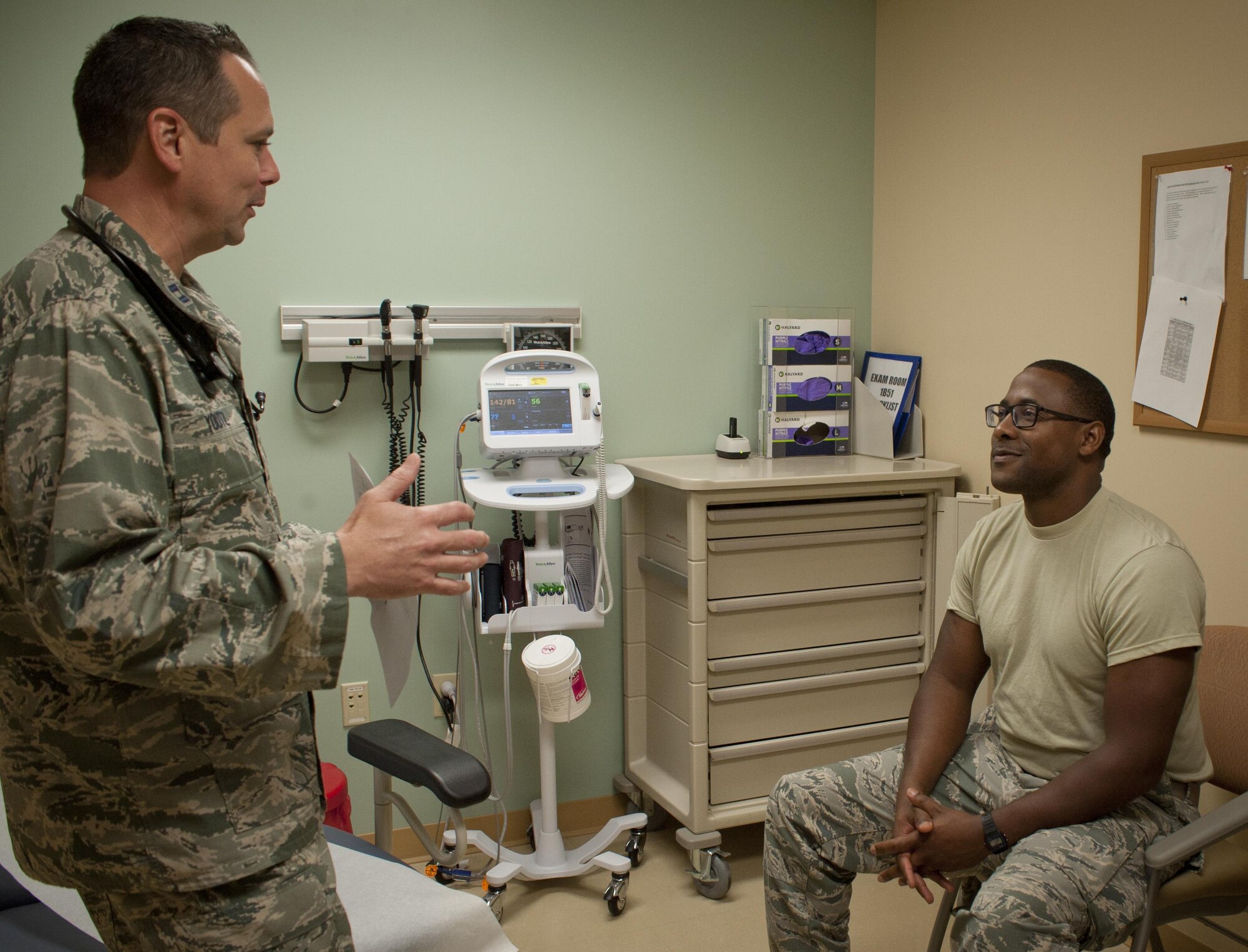 U.S. Air Force Capt. Gregory Youtz, a family health physician assistant assigned to the 6th Medical Support Operations Squadron, talks to a patient in the 6th Medical Group Clinic at MacDill Air Force Base, Fla., Sept. 7, 2017. The family health clinic cares for over 19,000 patients. (U.S. Air Force photo by Senior Airman Mariette Adams)