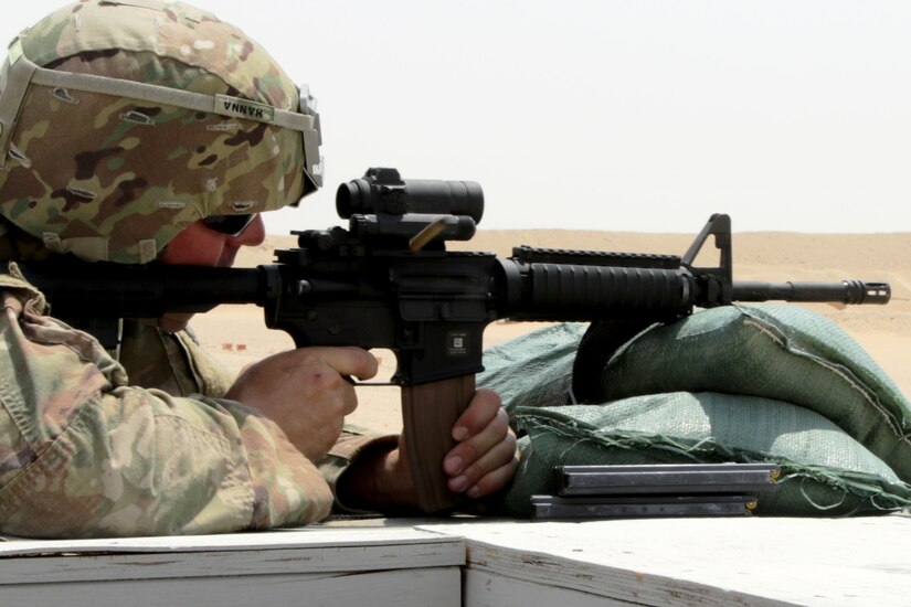 Soldier aiming a gun.