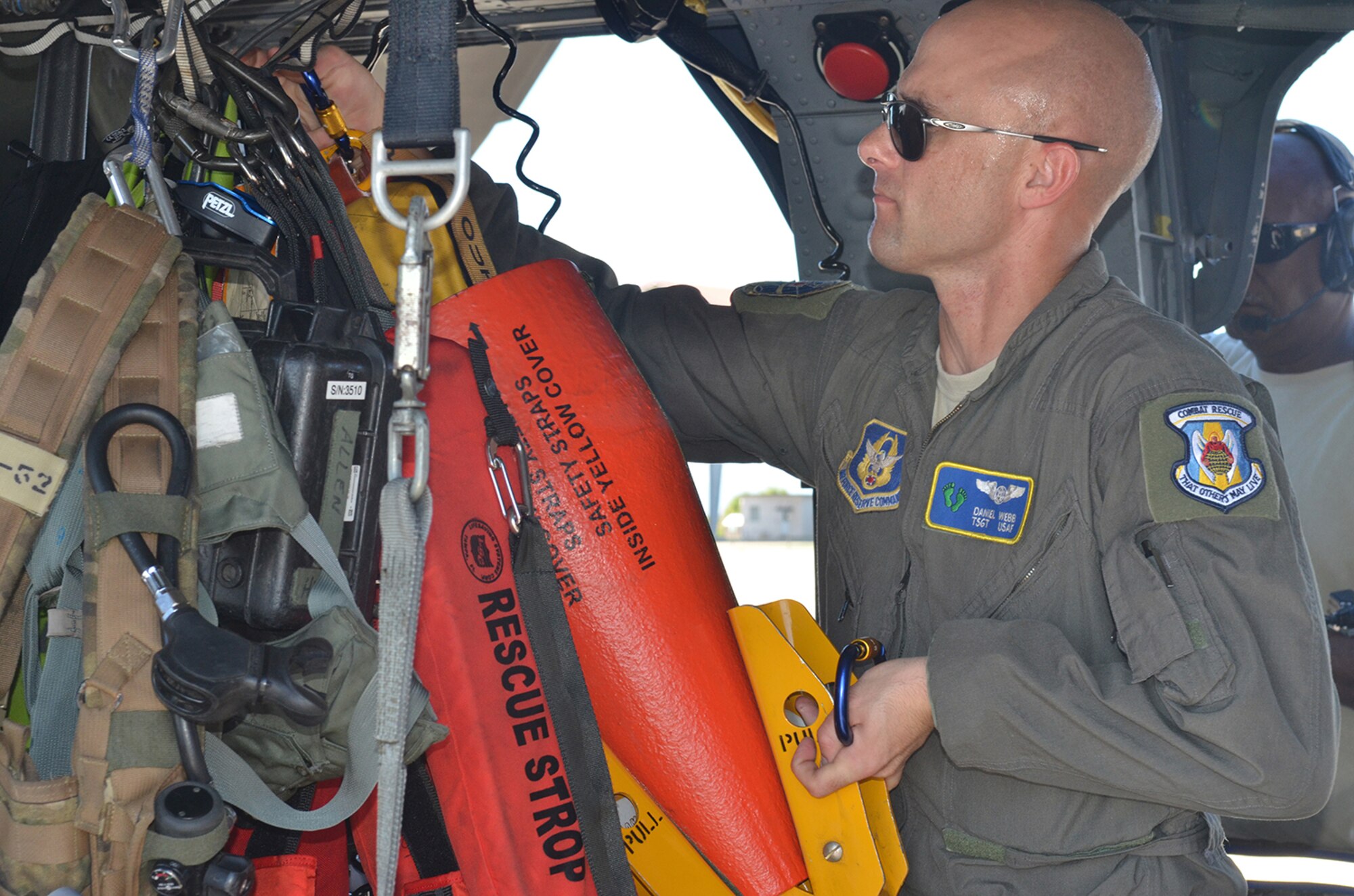 Tech. Sgt. Daniel Webb, special mission aviator, readies an HH-60G Pave Hawk helicopter to be relocated September 7 in response to Hurricane Irma’s projected path and to pre-position for rescue efforts after the storm if needed. Aircrews flew three HH-60G “Jolly” Pave Hawk helicopters to Orlando; and two HC-130P/N “King” fixed-wing aerial refueling aircraft to Georgia; while pararescue teams configured as a rescue assets in case they are called into action from the aftermath of the storm. (U.S. Air Force photo/Maj. Cathleen Snow)