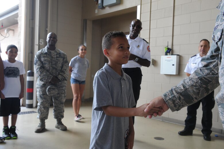 Young Hurlburt hero named honorary firefighter