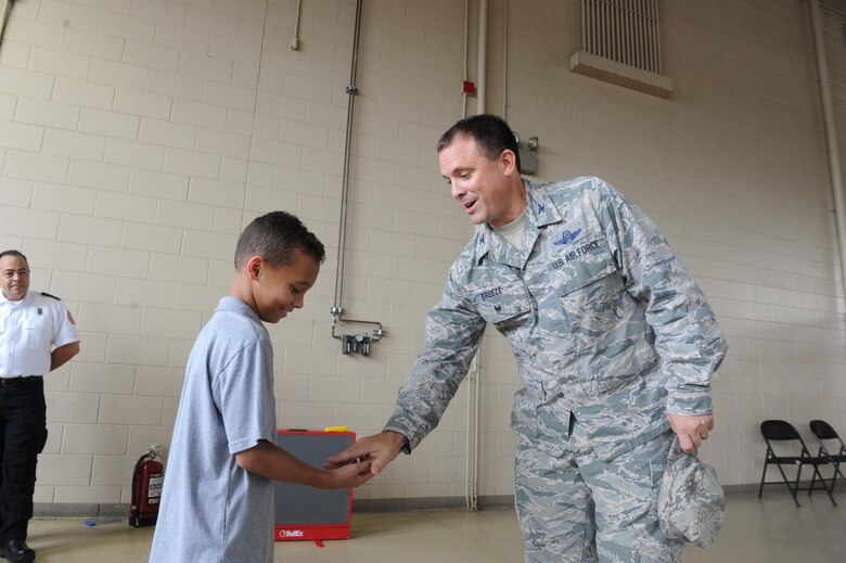 Young Hurlburt hero named honorary firefighter