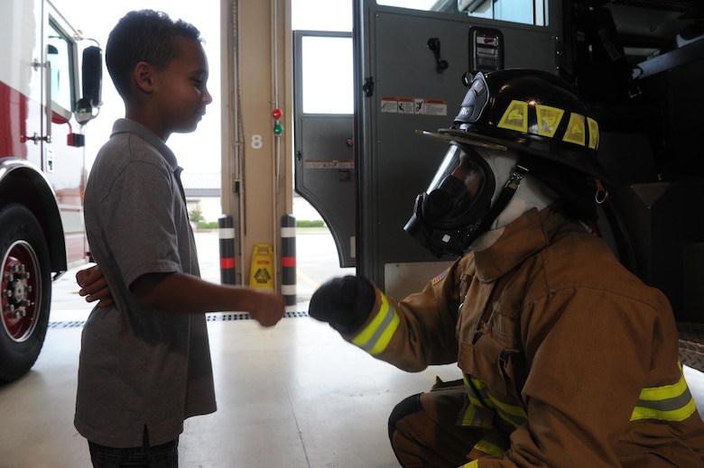 Young Hurlburt hero named honorary firefighter