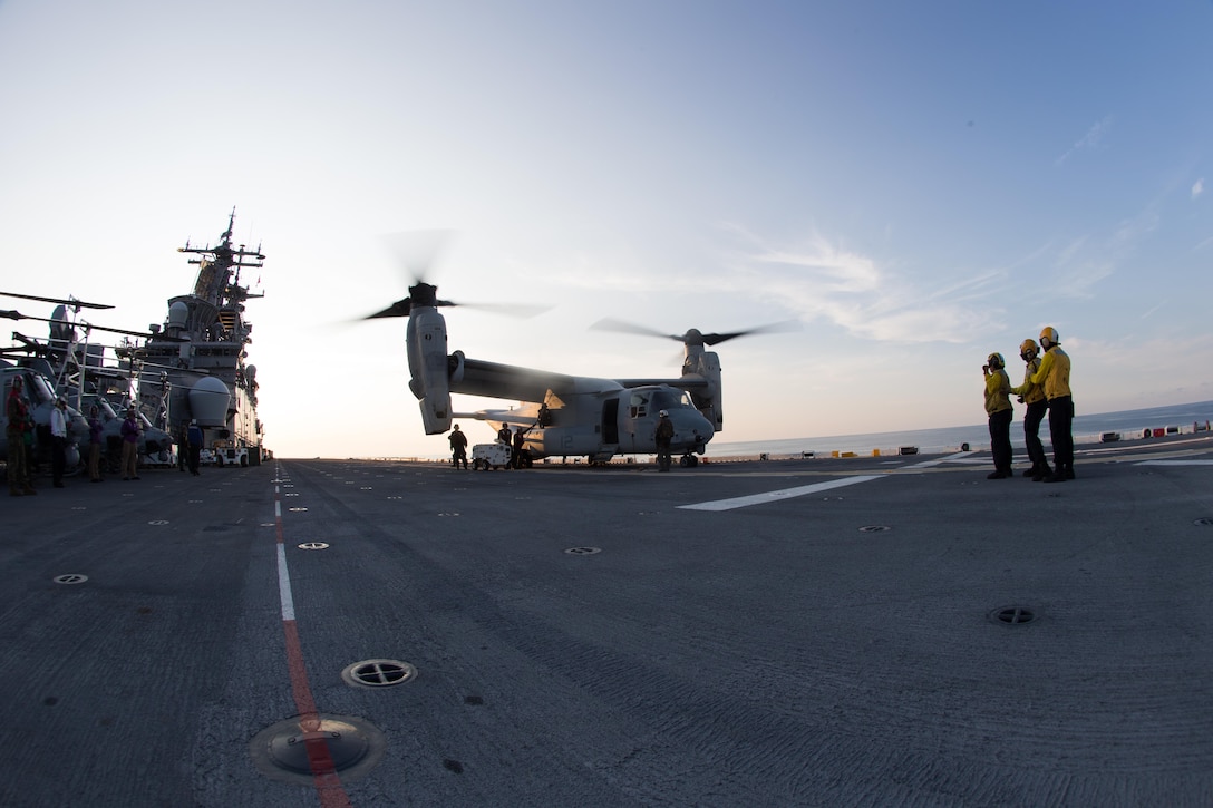 U.S. Marines and Sailors with the 26th Marine Expeditionary Unit (MEU), work together to unload an MV-22B Osprey with Marine Medium Tiltrotor Squadron 162 (Reinforced), 26th MEU, aboard the amphibious assault ship USS Kearsarge in the Atlantic Ocean, Sep. 3, 2017. Approximately 690 Marines and Sailors with the 26th MEU embarked aboard the amphibious assault ship as part of prudent measures in anticipation of future tasking to support Hurricane Irma relief efforts.  (U.S. Marine Corps photo by Lance Cpl. Alexis C. Schneider)