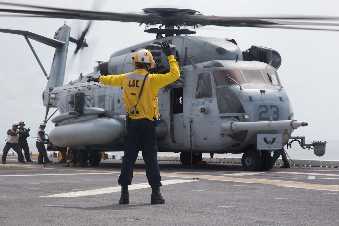 U.S. Marines and Sailors work together to offload a CH-53E Super Stallion with Marine Medium Tiltrotor Squadron 162 (Reinforced), 26th Marine Expeditionary Unit (MEU), aboard the amphibious assault ship USS Kearsarge in the Atlantic Ocean, Sep. 3, 2017. Approximately 690 Marines and Sailors with the 26th MEU embarked aboard the amphibious assault ship as part of prudent measures in anticipation of future tasking to support Hurricane Irma relief efforts.  (U.S. Marine Corps photo by Lance Cpl. Alexis C. Schneider)
