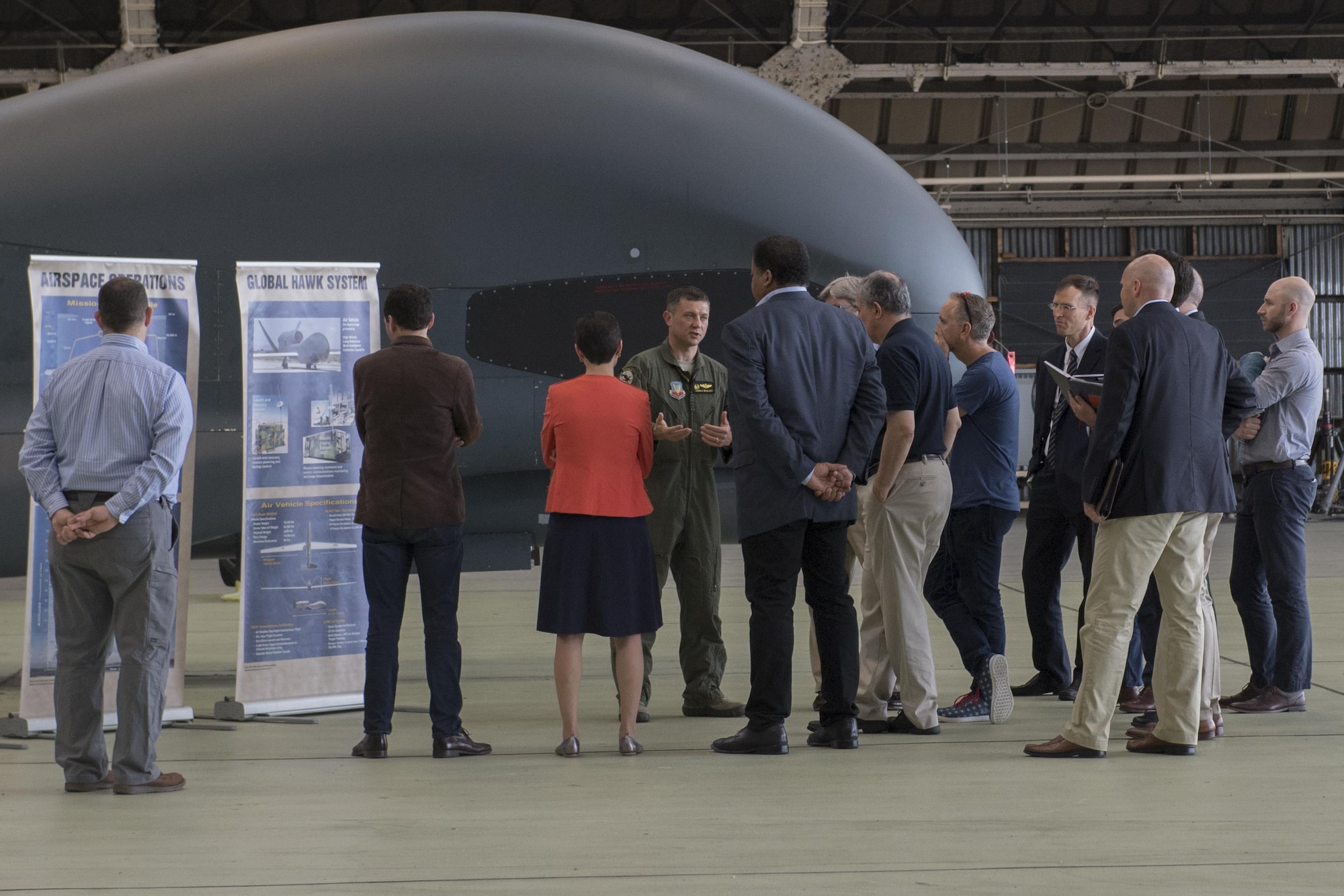 Members of the Defense Innovation Board tour the RQ-4 Global Hawk hangar Sept. 6, 2017, at Yokota Air Base, Japan.