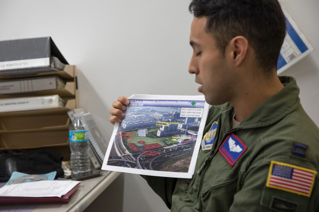 Capt. Jonathan Bonilla, 459th Airlift Squadron UH-1N operations flight commander, shows a planned landing zone during a mission briefing