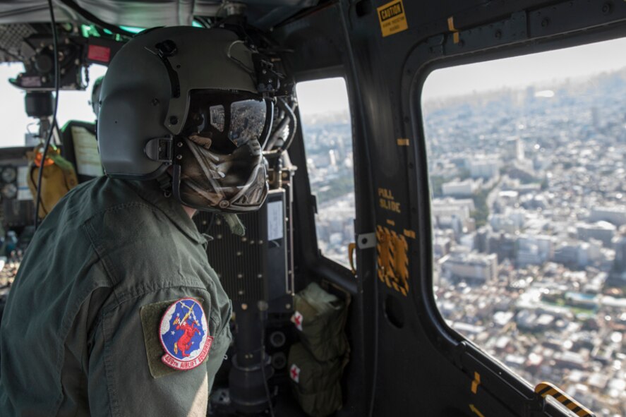 Tech. Sgt. David Jacobs, 459th Airlift Squadron special missions aviator, performs visual confirmation