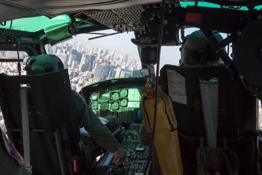 Capt. Jonathan Bonilla and Capt. Jonathan Coffey, both 459th Airlift Squadron UH-1N pilots, fly over the Tokyo metropolitan area