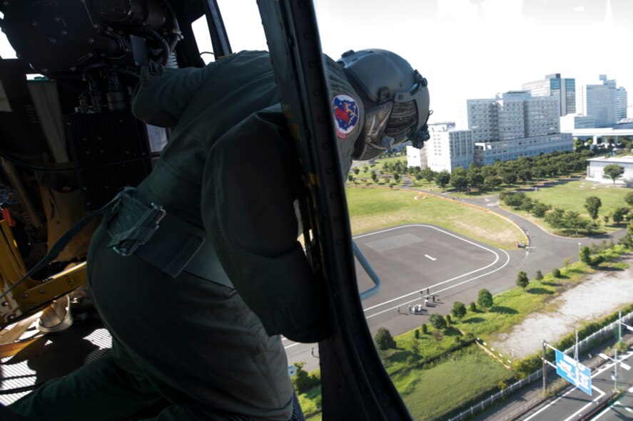 Tech. Sgt. David Jacobs, 459th Airlift Squadron special missions aviator, performs visual confirmation