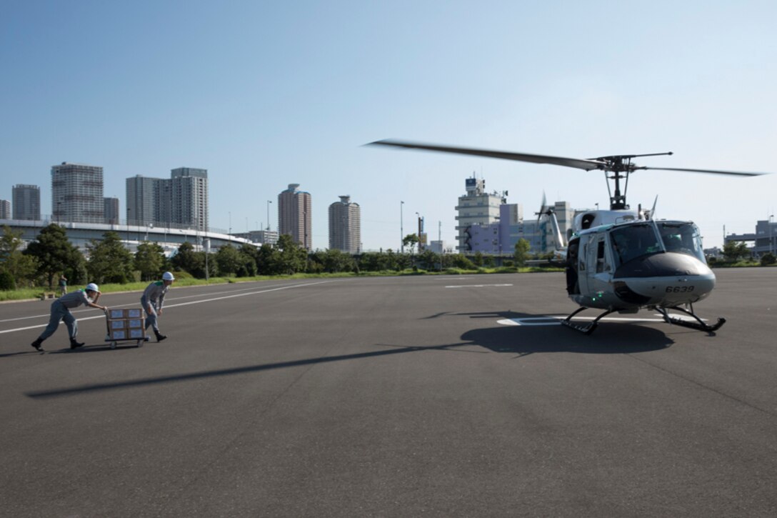 Members with the Tokyo Metropolitan Government bring simulated relief supplies at Tokyo Rinkai Disaster Prevention Park, Koto Ward, Japan, Sept. 3, 2017