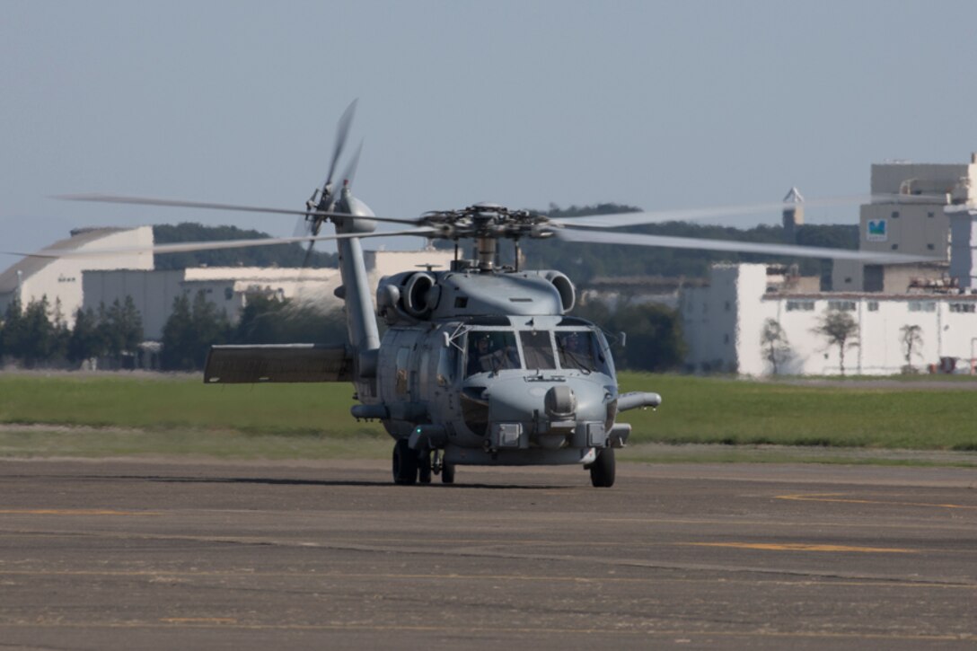 A U.S. Navy MH-60R Seahawk assigned to Helicopter Maritime Strike Squadron (HSM) 51, Naval Air Facility Atsugi, taxis the flight line at Yokota Air Base, Japan