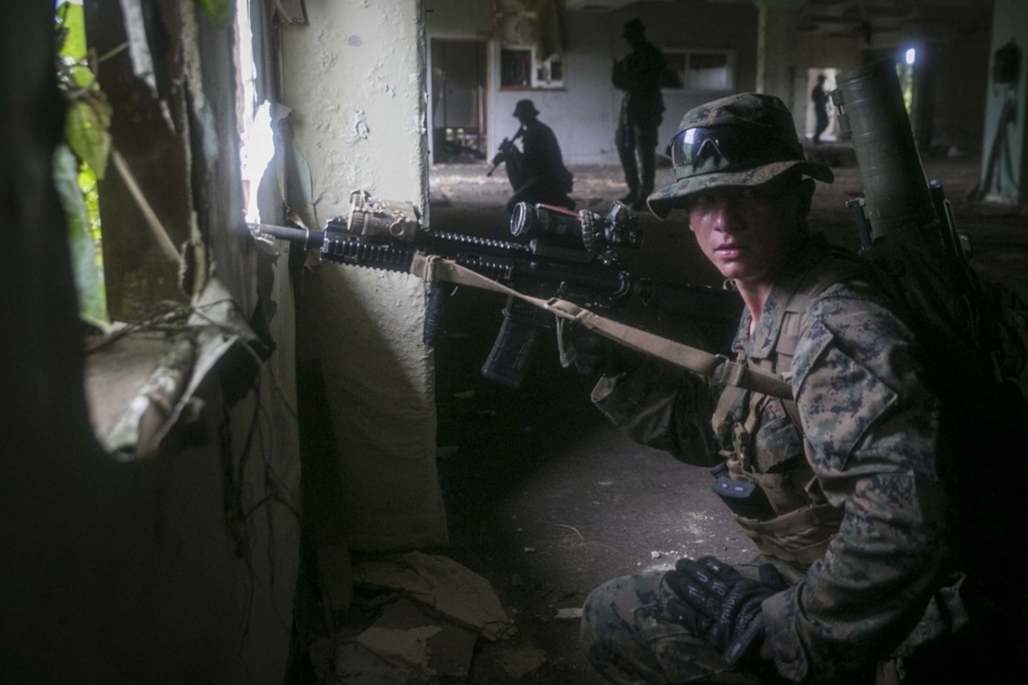Lance Cpl. Cody L. Jowers, a rifleman with India Company, Battalion Landing Team, 3rd Battalion, 5th Marines, sets security during Military Operations in Urbanized Terrain (MOUT) training at Andersen South Air Force Base, Guam, August 30, 2017. Marines with BLT 3/5 train regularly in different environments to maintain their readiness as the Ground Combat Element of the 31st Marine Expeditionary Unit. The 31st MEU partners with the Navy's Amphibious Squadron 11 to form the Bonhomme Richard Expeditionary Strike Group, providing a cohesive blue-green team capable of accomplishing a variety of missions across the Indo-Asia-Pacific region. (U.S. Marine Corps photo by Cpl. Amaia Unanue/Released)
